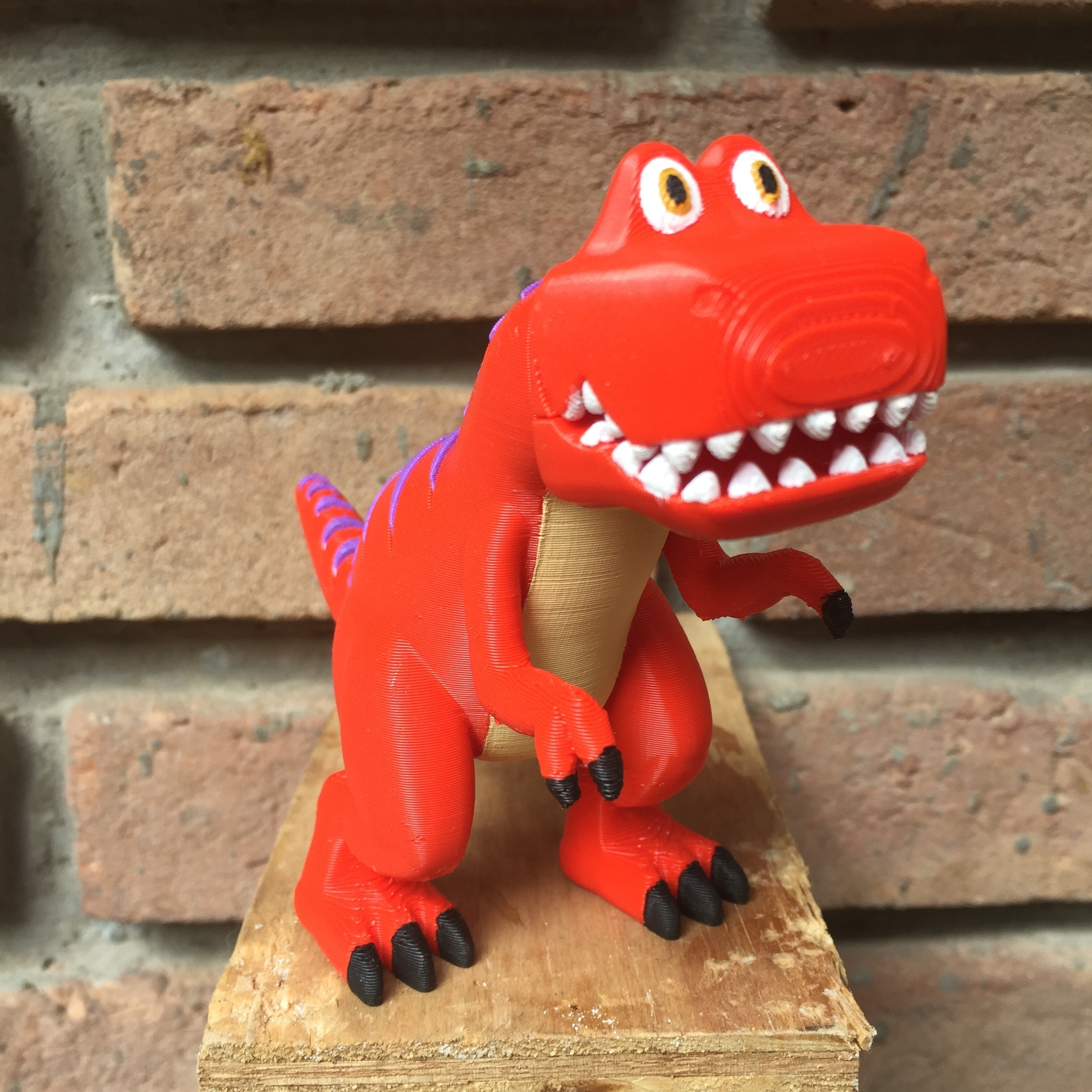 Orange best sale dinosaur toy